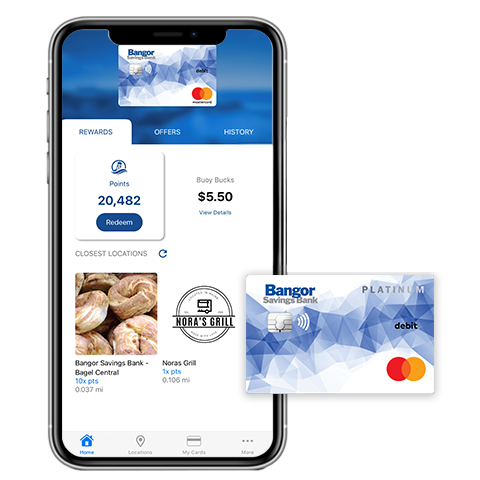 The Buoy Local app* open on a phone with a Bangor Savings Bank Debit Mastercard® and a Buoy Local Card