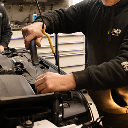 A mechanic working on a car
